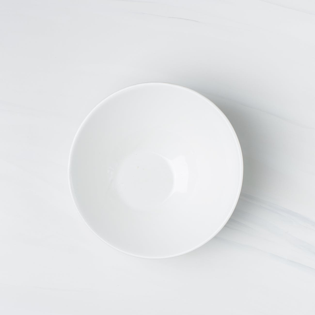 flatlay photography of white ceramic bowl